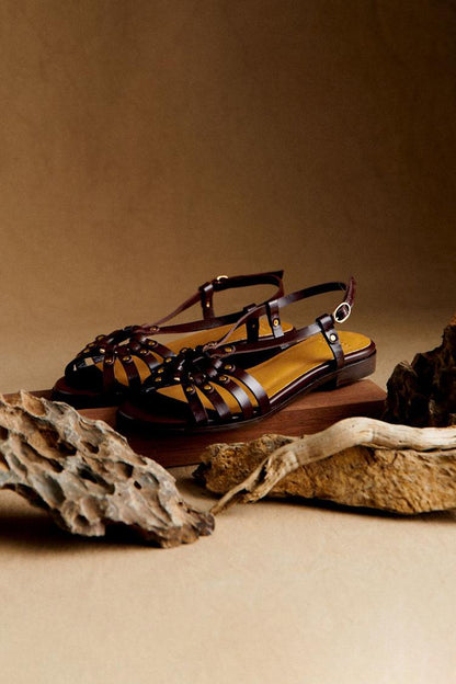 Carlotta dark brown studded open toe sandals detail of woven straps
