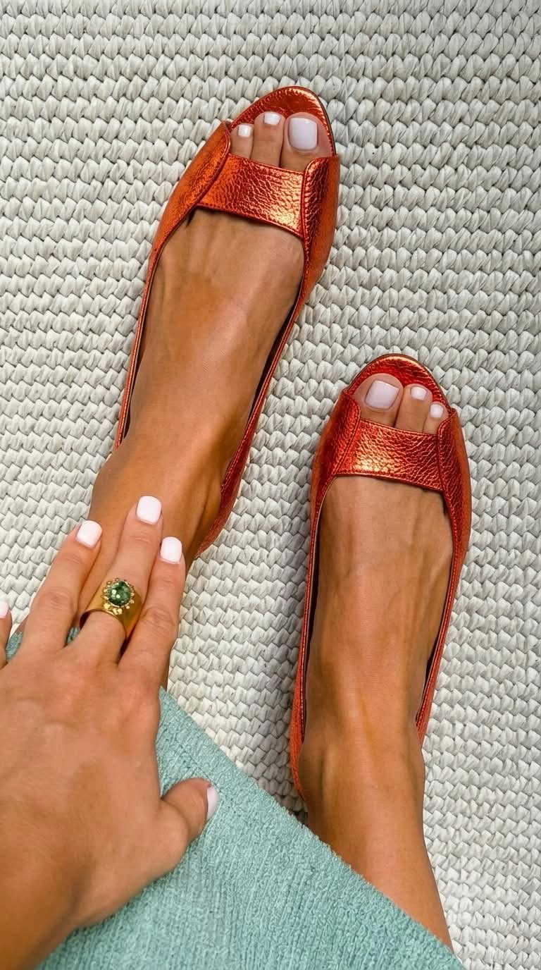 Vittoria metallic textured peep toe flats in Orange
